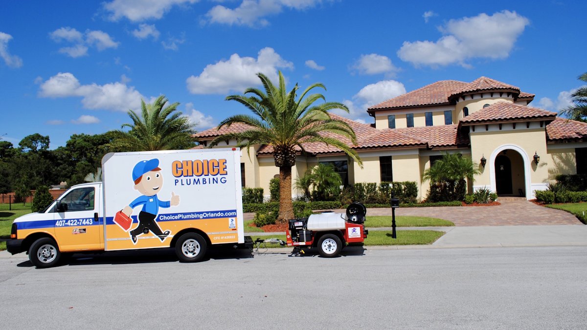 Choice Plumbing Orlando service van with hydro-jetter trailer at a Windermere home in the Butler Chain of Lakes area, 34786
