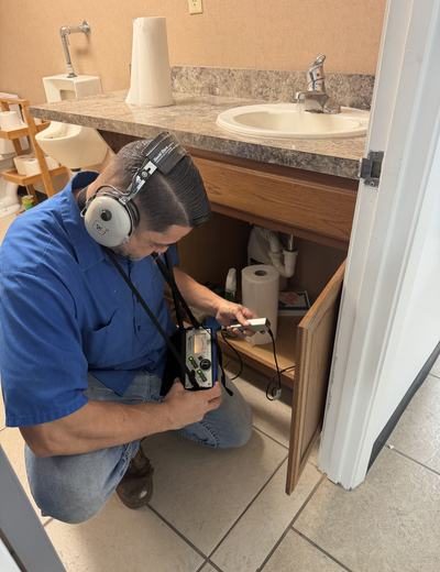 Choice Plumbing Orlando technician under sink leak detection