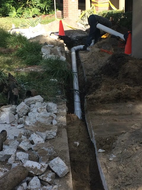 Fitting the new PVC connections in the trench