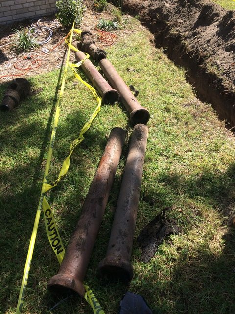 Old clay pipe sections removed from the yard