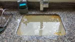 Unclog of kitchen sink drain. Sink drain cleaning and repair.