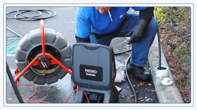 plumber providing a plumbing inspection using a camera