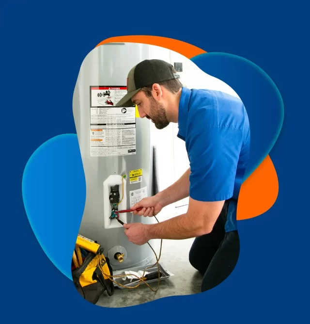 Plumber working on a water heater